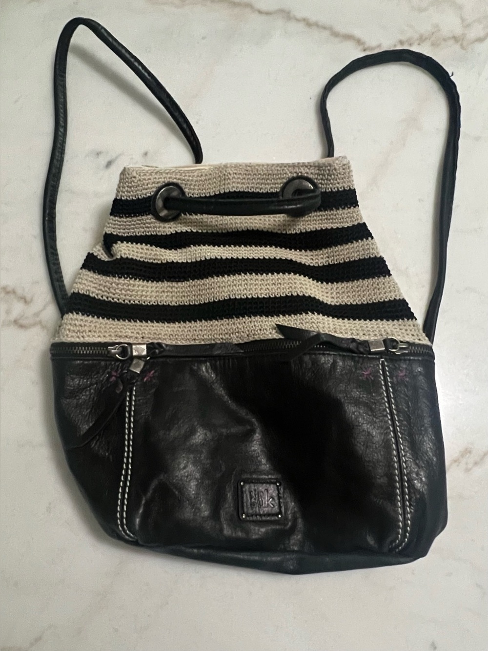 The Sak striped crochet and black leather convertible backpack